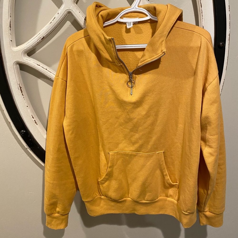full tilt, yellow sweatshirt.